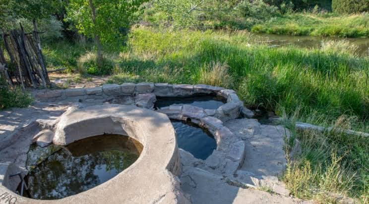 Montezuma Hot Springs New Mexico - cement tubs on the Gallinas River with Montezuma Castle nearby