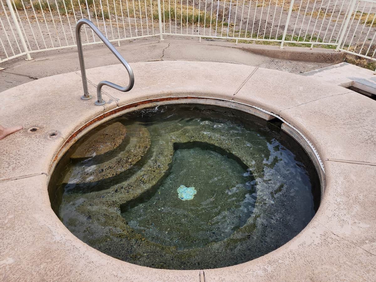 Outdoor concrete hot spring pool at hot well dunes arizona