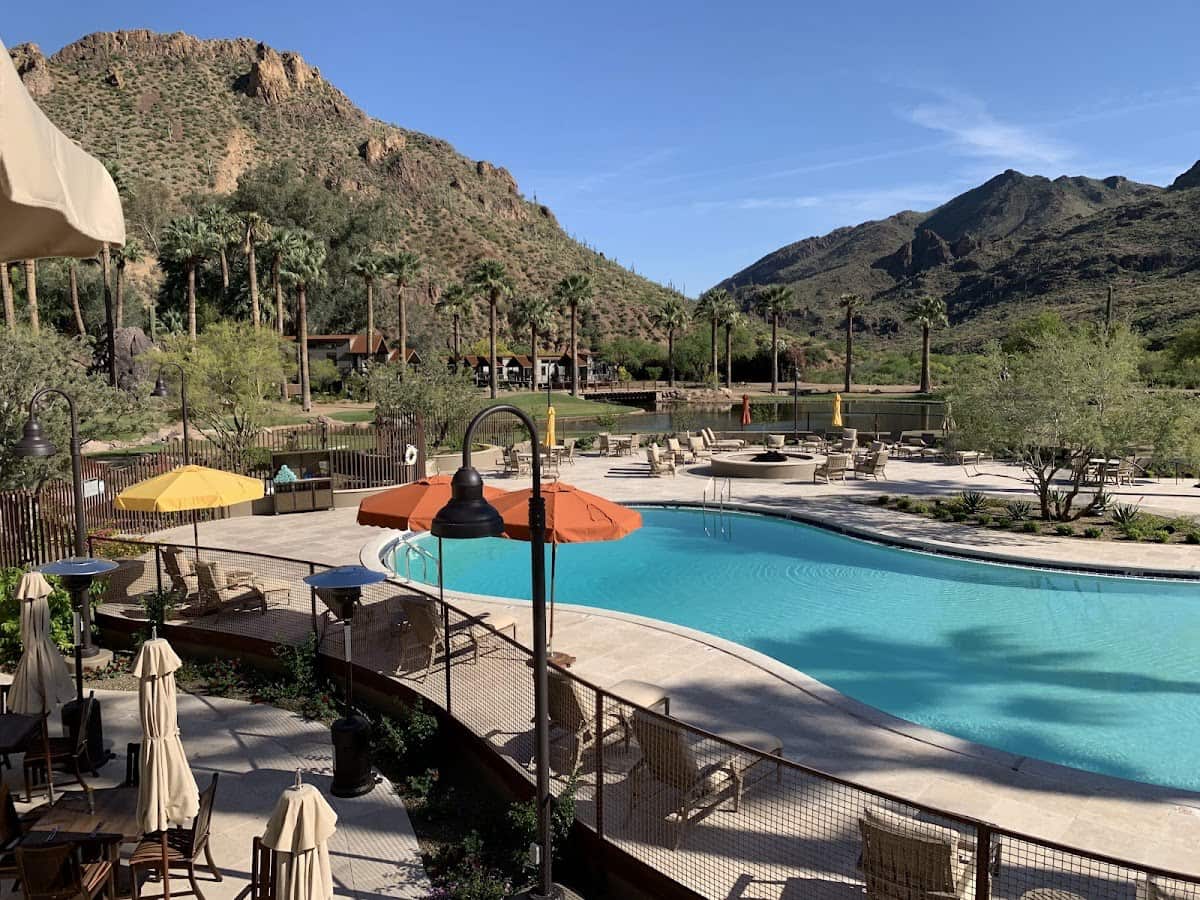 Outdoor hot spring pool in resort setting with mountain views in castle hot springs arizona