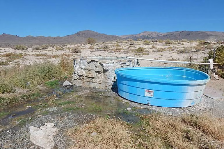 Hot spring bathtub on a desert hillside in kyle hot springs nevada