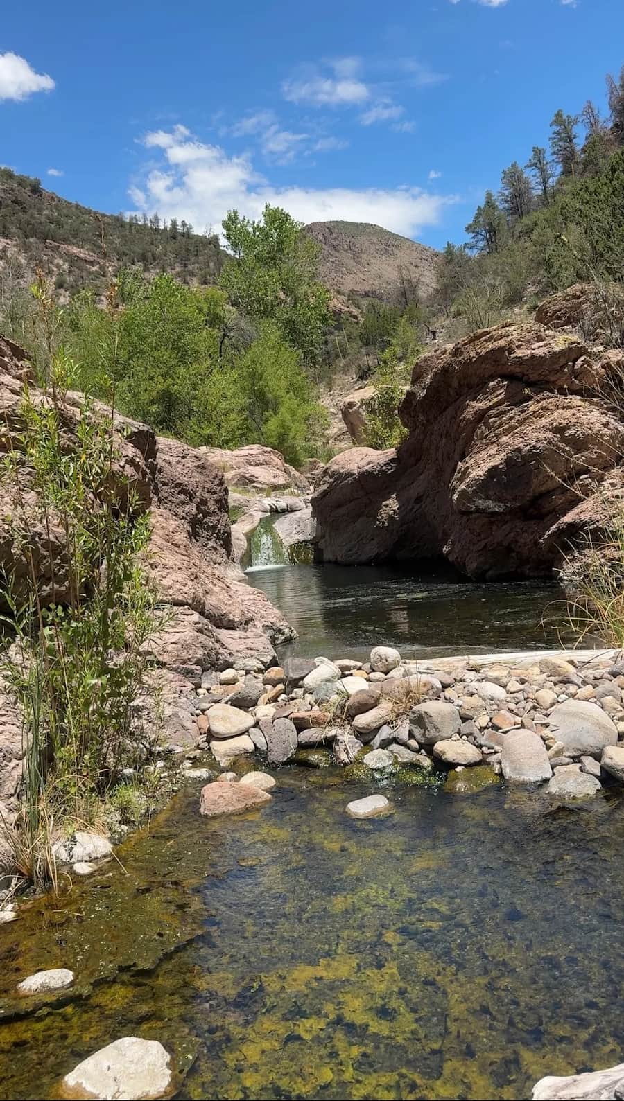 Turkey creek and hot spring pools surrounded by mountains at turkey creek hot springs new mexico
