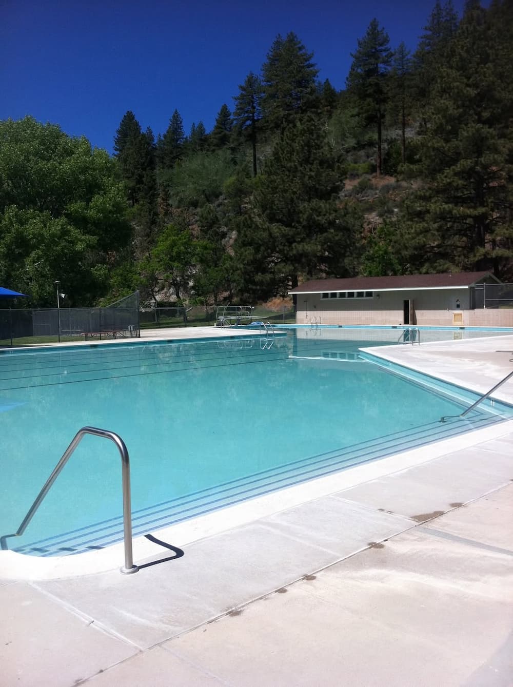 Outdoor hot spring pool and historic mansion at bowers mansion hot springs nevada