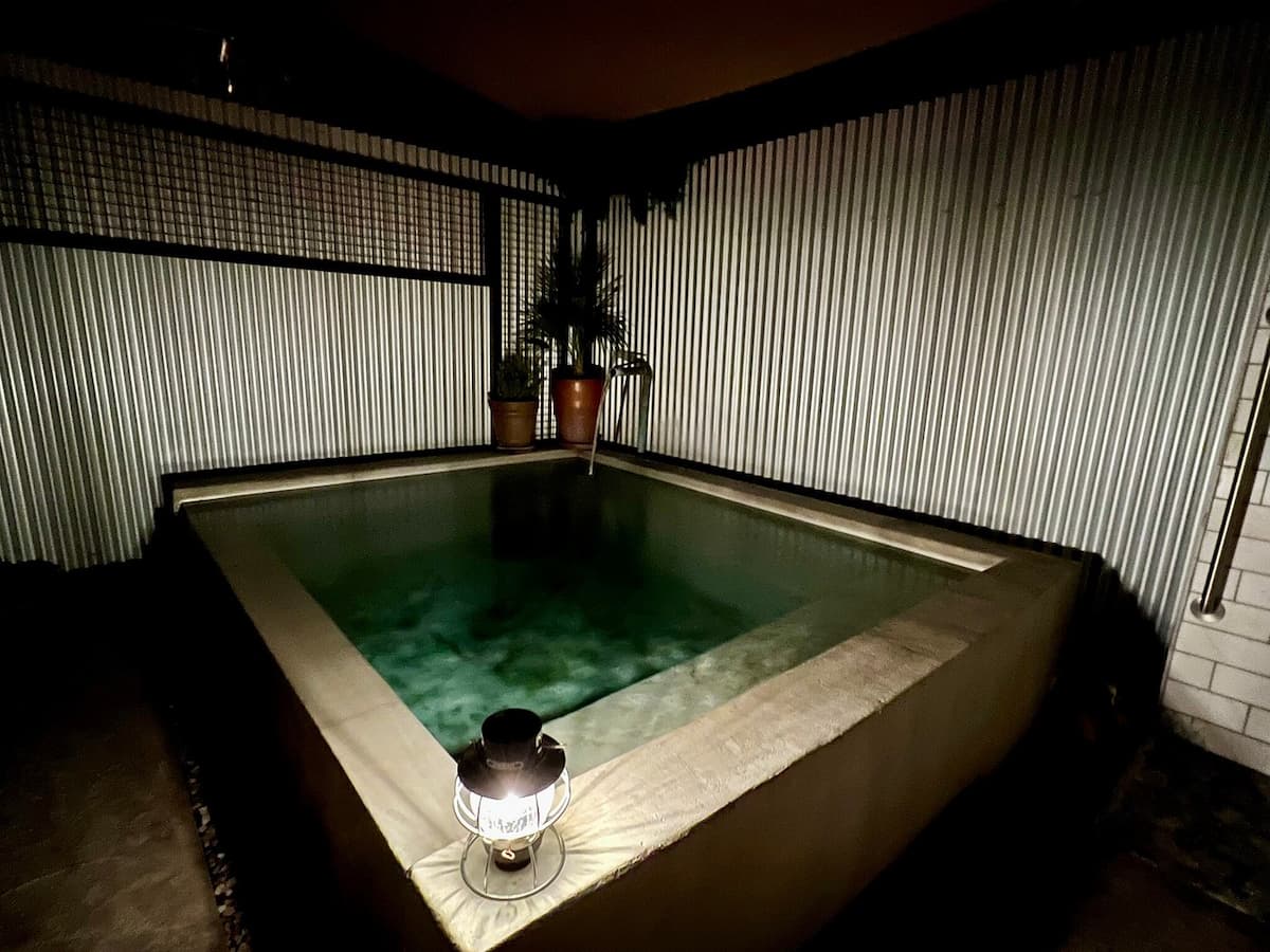 Indoor hot spring tub with atmospheric lighting at hoosier hot springs and inn new mexico