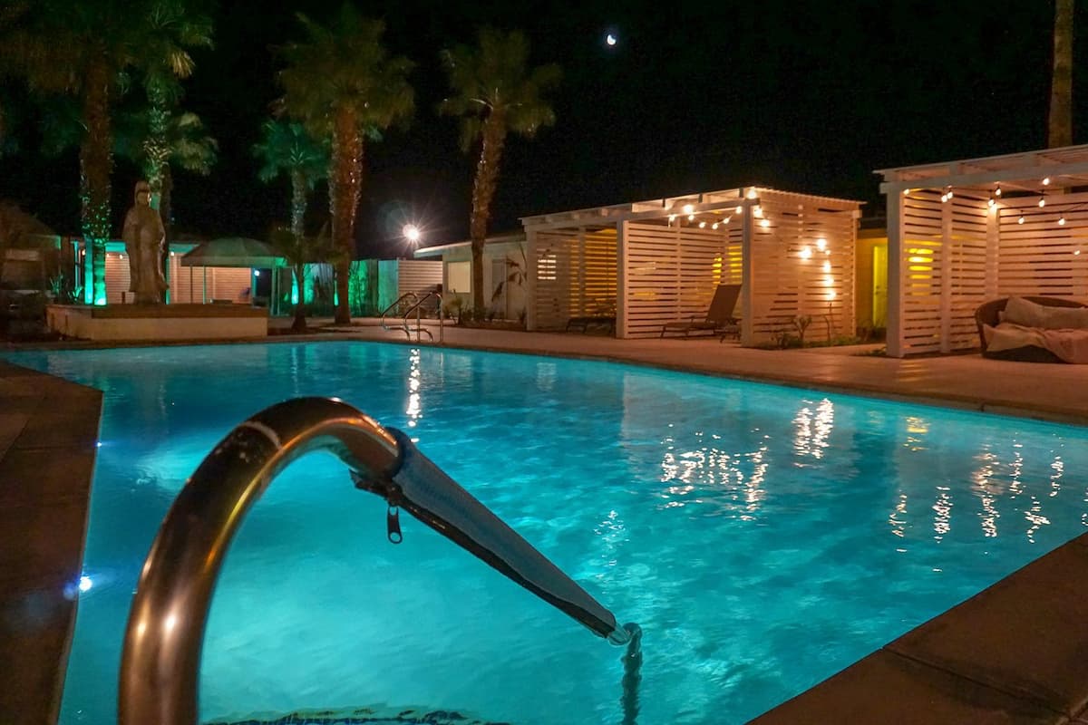 Outdoor hot spring pool with evening lights at the o spa resort california