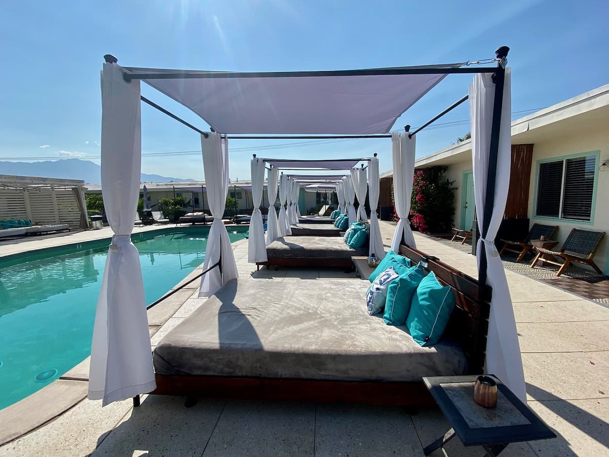 Sunbathing beds next to outdoor hot spring pool at the o spa resort california