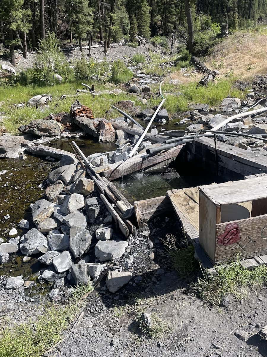 Outdoor hot spring pool in a forest setting at slate creek hot springs idaho