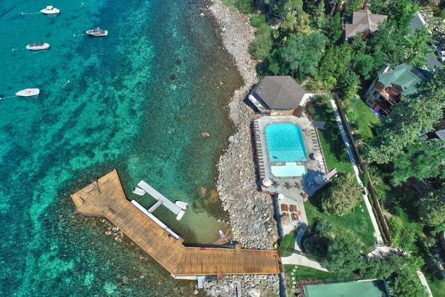 birds eye view of a hot spring resort next to a lake at brockway springs resort california