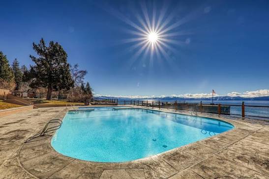 hot spring pool overlooking a lake at brockway springs resort california