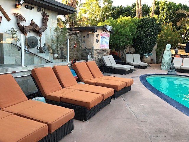 sunbathing lounge chairs beside a hot spring pool at sea mountain inn california