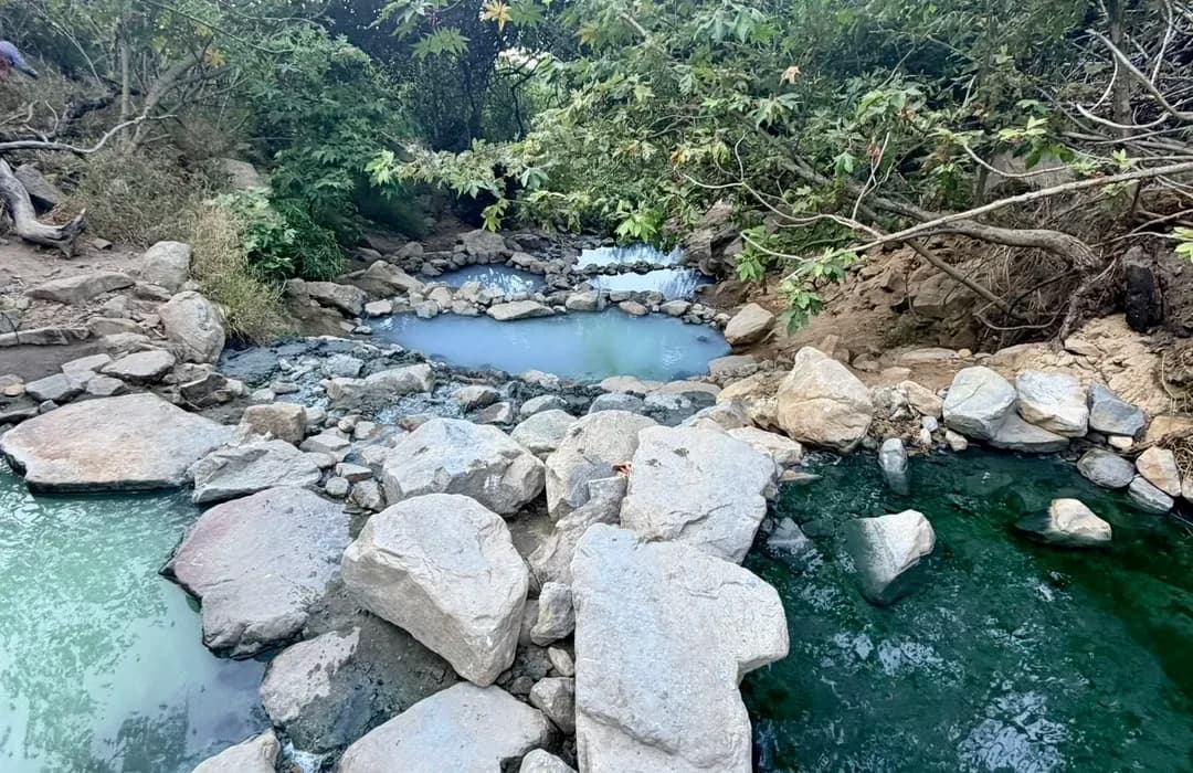cascading natural hot spring pools with green blue water at montecito hot springs california