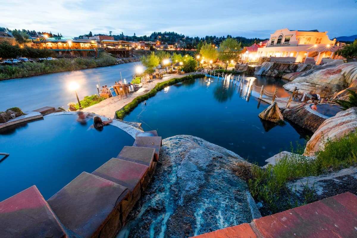 people soaking in outdoor hot springs pool along the san juan river at the springs resort and spa colorado