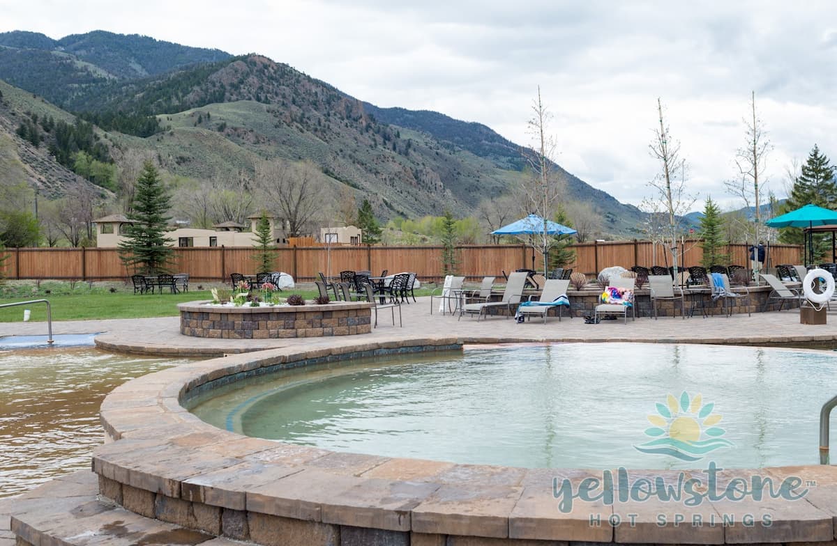 Outdoor hot spring pool with mountain valley views at yellowstone hot springs montana