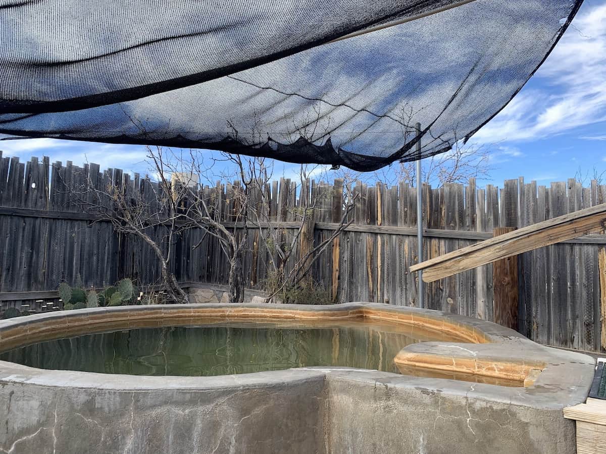 shaded developed hot spring pool at faywood hot springs new mexico