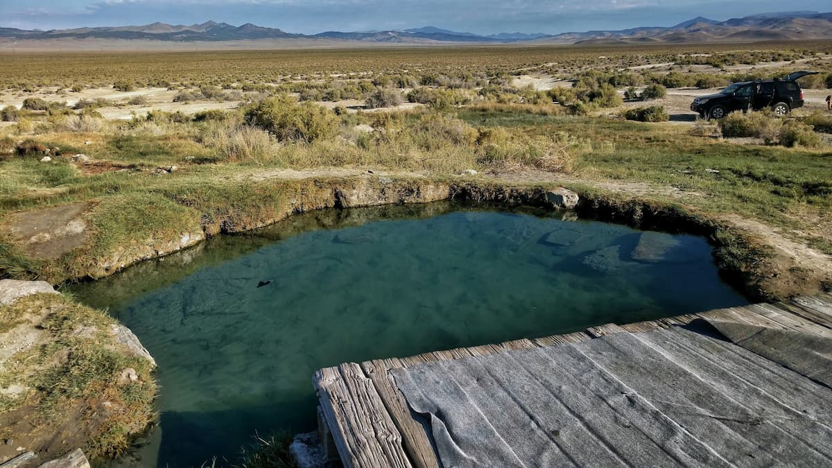 Outdoor natural hot spring pool in a desert setting at spencer hot springs in nevada