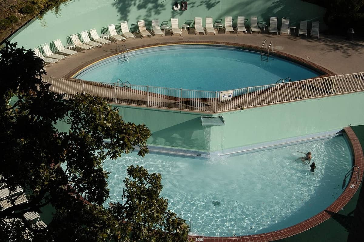 Outdoor developed hot spring pools surrounded by sunloungers at arlington hot springs resort and spa arkansas