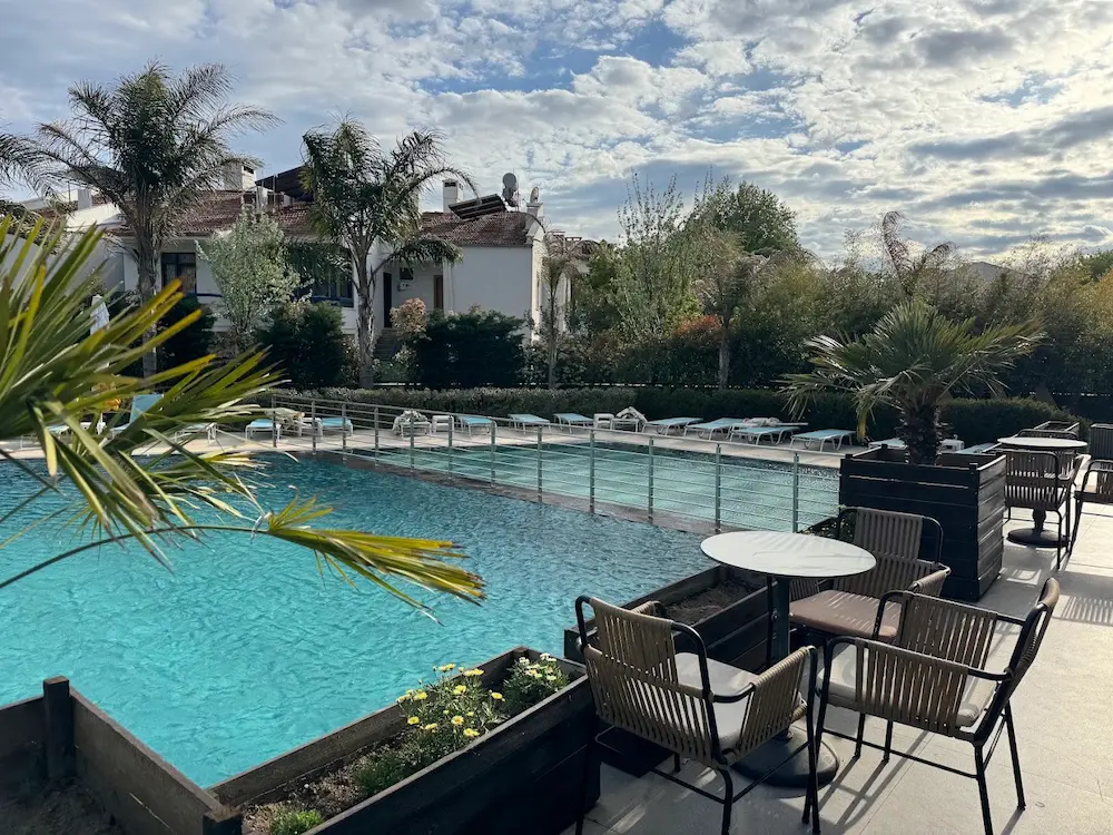 Outdoor hot spring pools with palms and sunloungers at gure thermal springs in turkey
