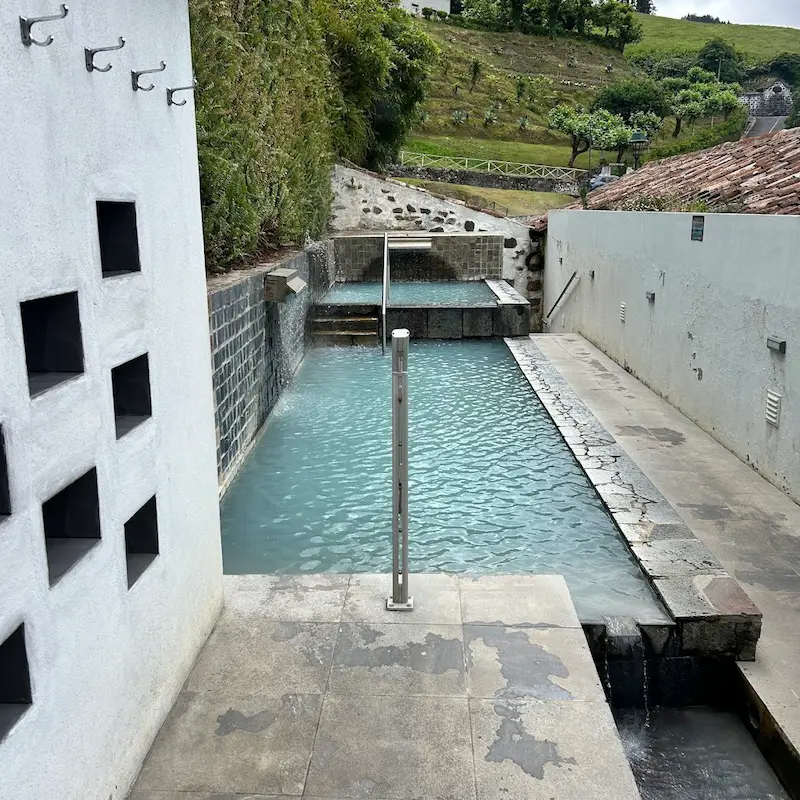 Outdoor developed hot springs pools in a spa complex at caldeiras da ribeira grande in portugal