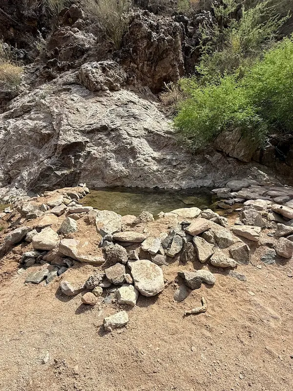 Natural rock walled hot spring pool in a canyon at kaiser hot springs in arizona