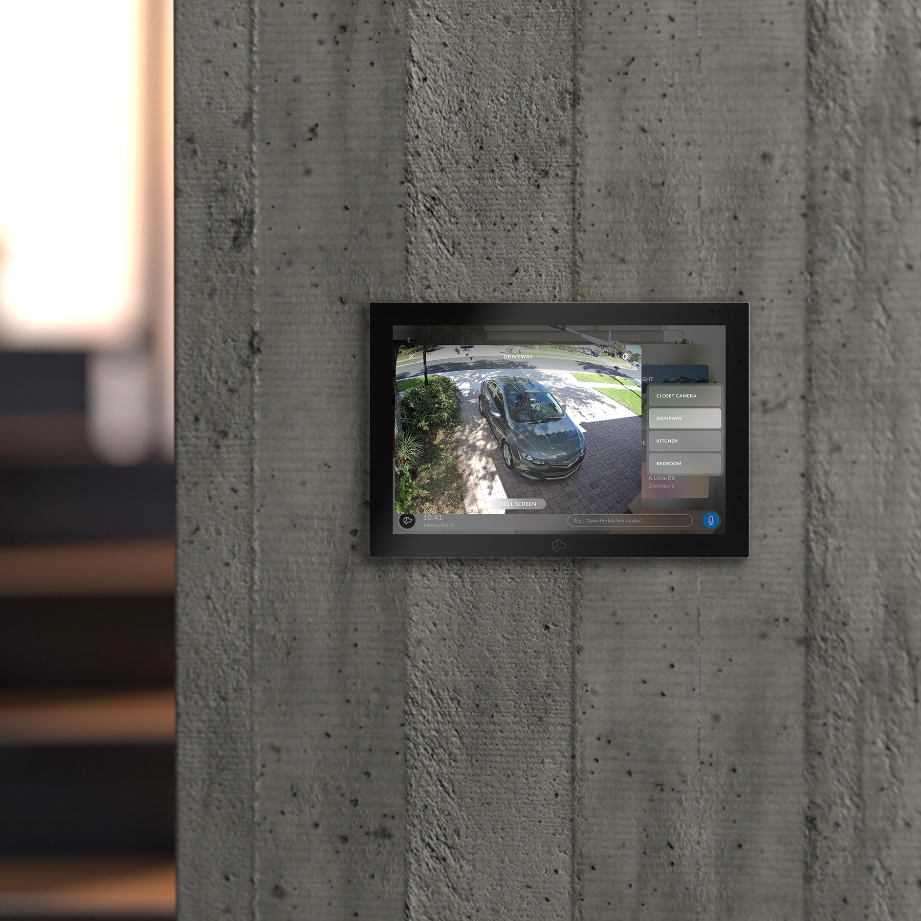 Josh touchscreen on a concrete wall showing a driveway camera feed