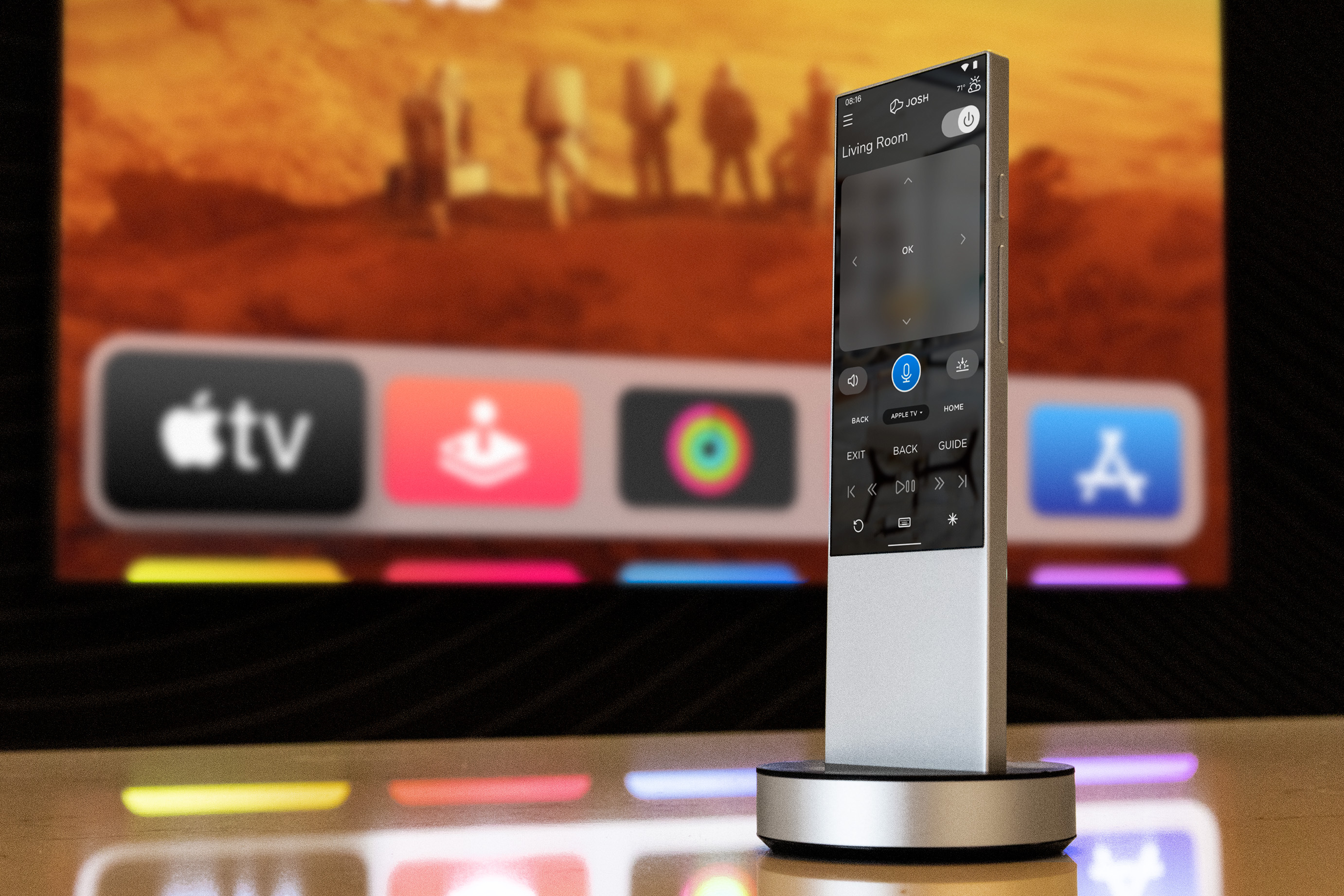 Josh remote on its dock in front of a television showing streaming apps