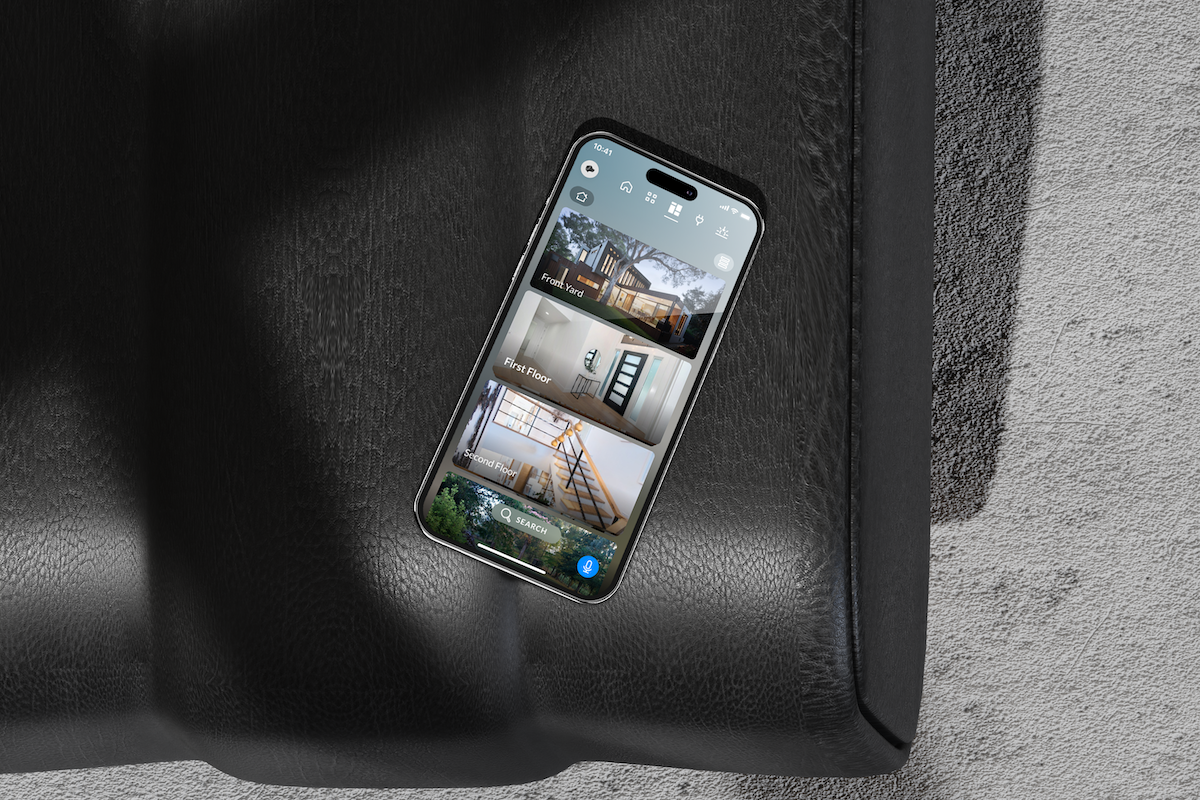Phone on a leather sofa showing Josh app room controls