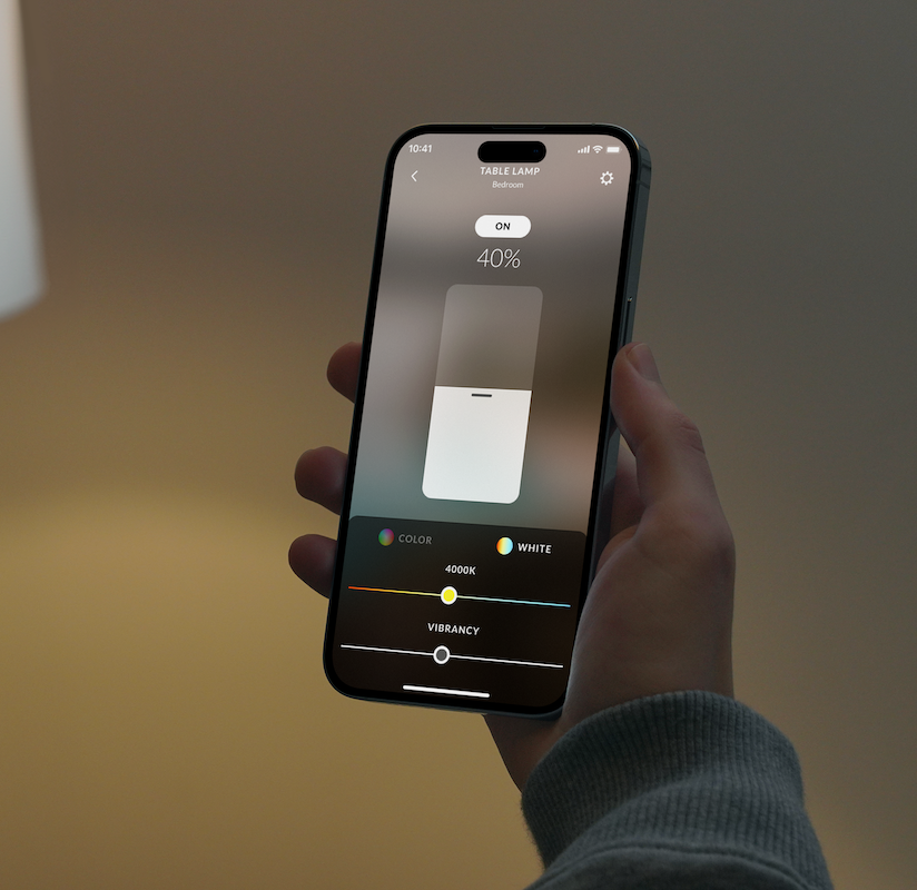Hand dimming a lamp to forty percent in the Josh app
