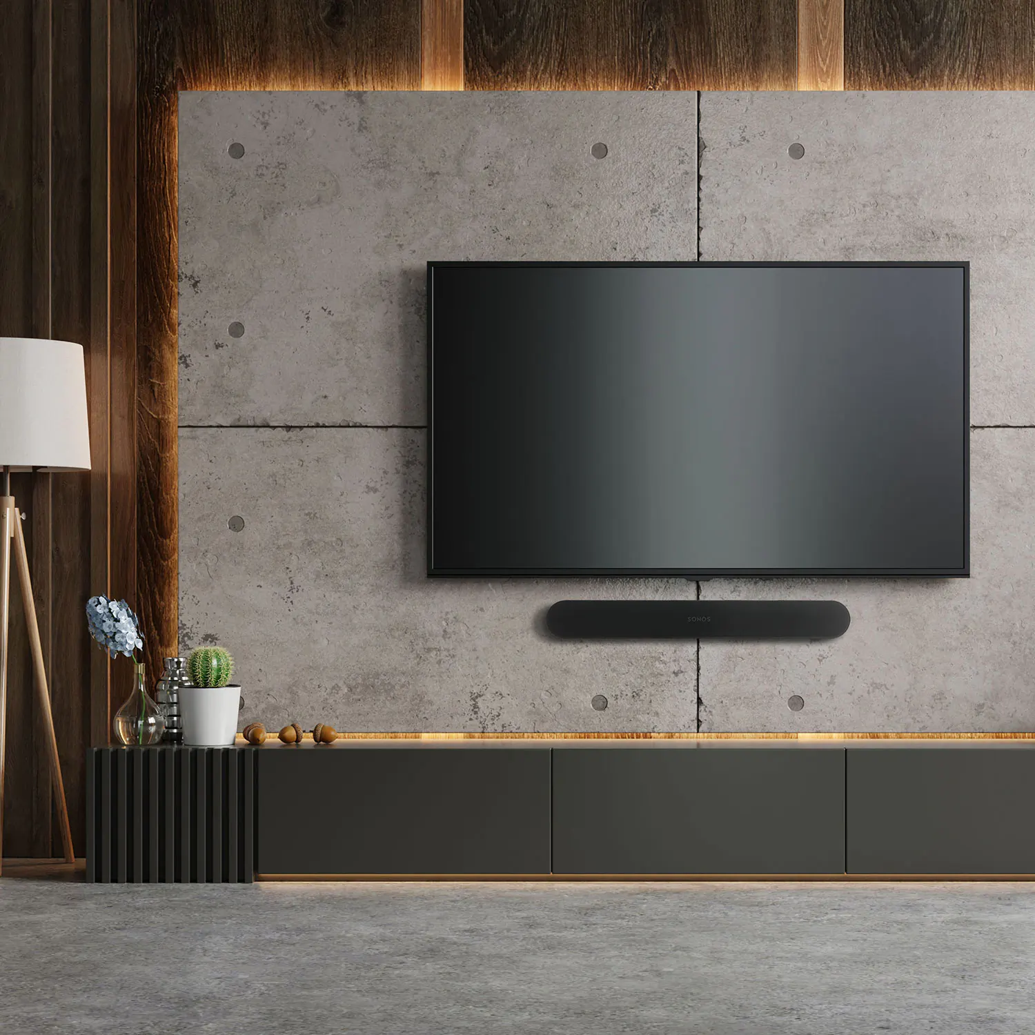 Sonos soundbar below a wall-mounted television on a concrete feature wall