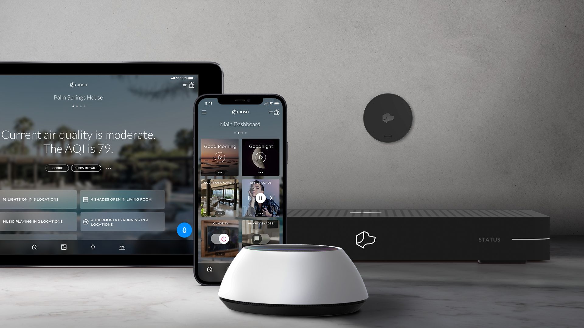 Josh.ai control app on a tablet and phone beside a Josh Micro speaker and a Josh Core processor on a marble surface
