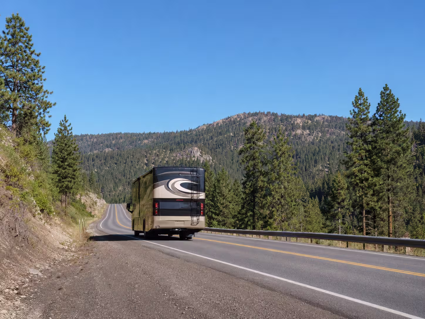 Large motorhome driving an Idaho mountain route