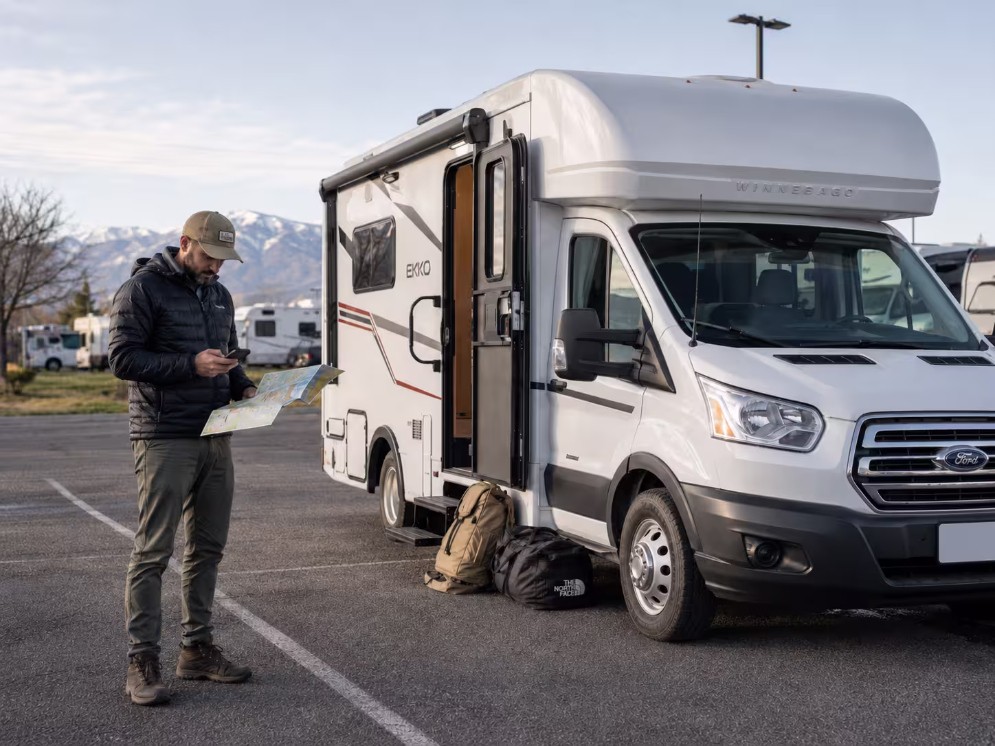 Renter planning a Boise route beside a small RV