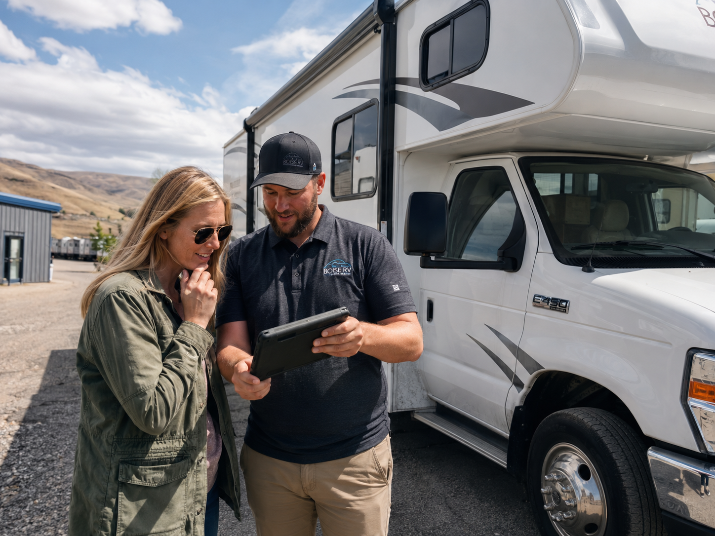 Manager explaining Boise RV rental prices to a renter at Boise Camper Rentals