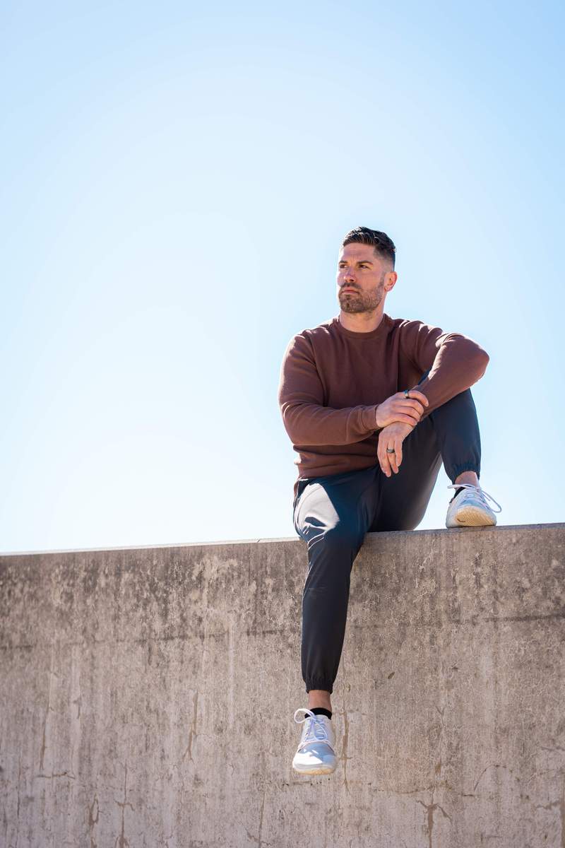 Josh sitting on a ledge