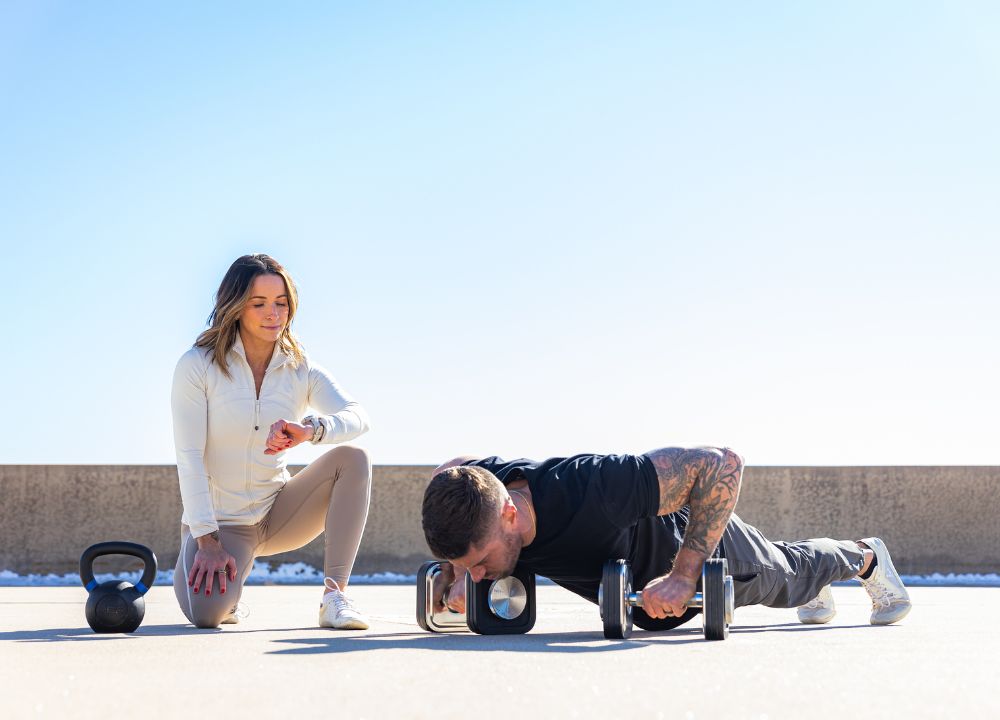 Josh doing pushups, Alessandra timing.