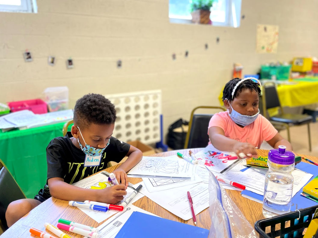 A DiSYPles student coloring in an art session. 