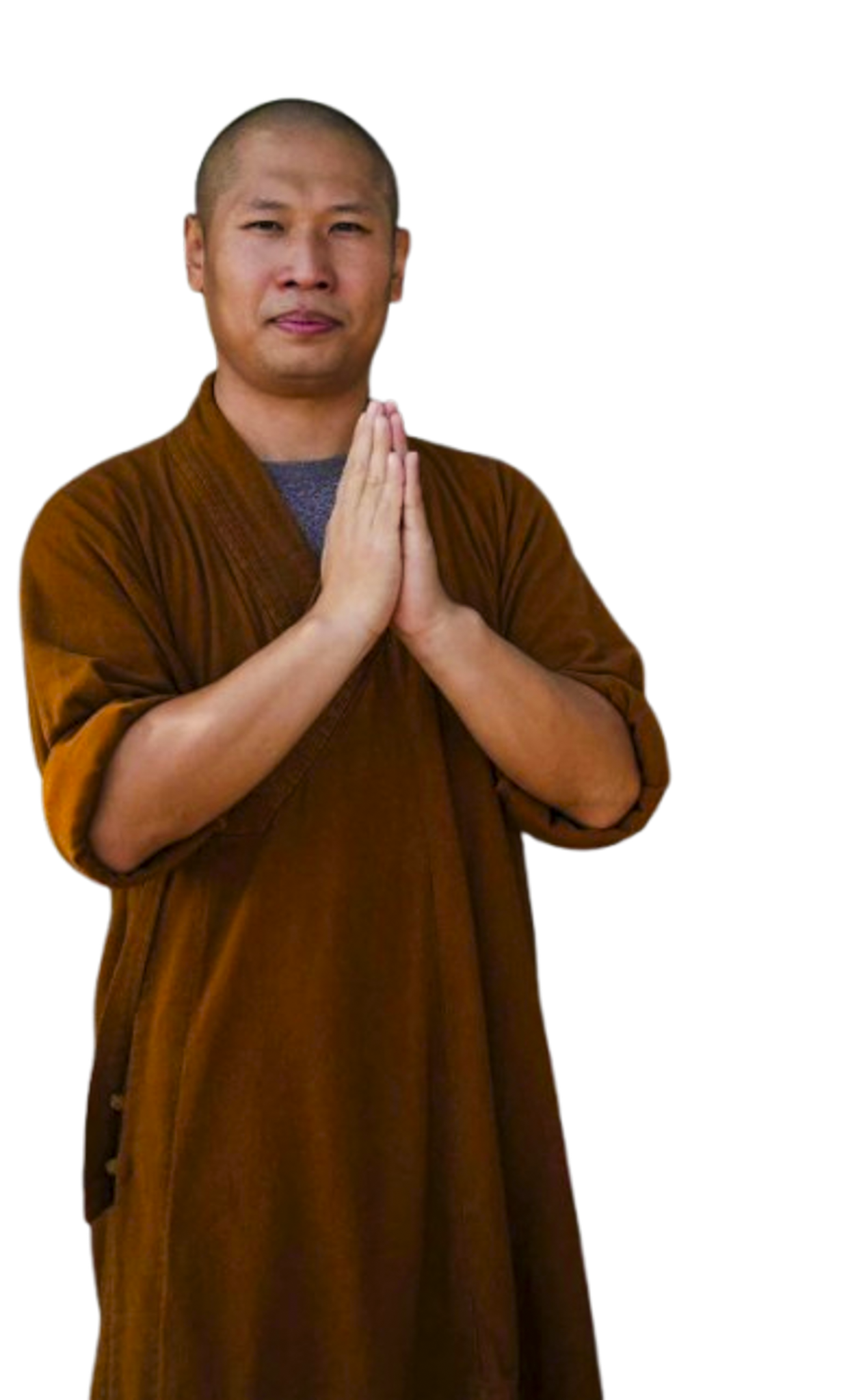 Bald man wearing a brown robe with hands pressed together in a prayer gesture.