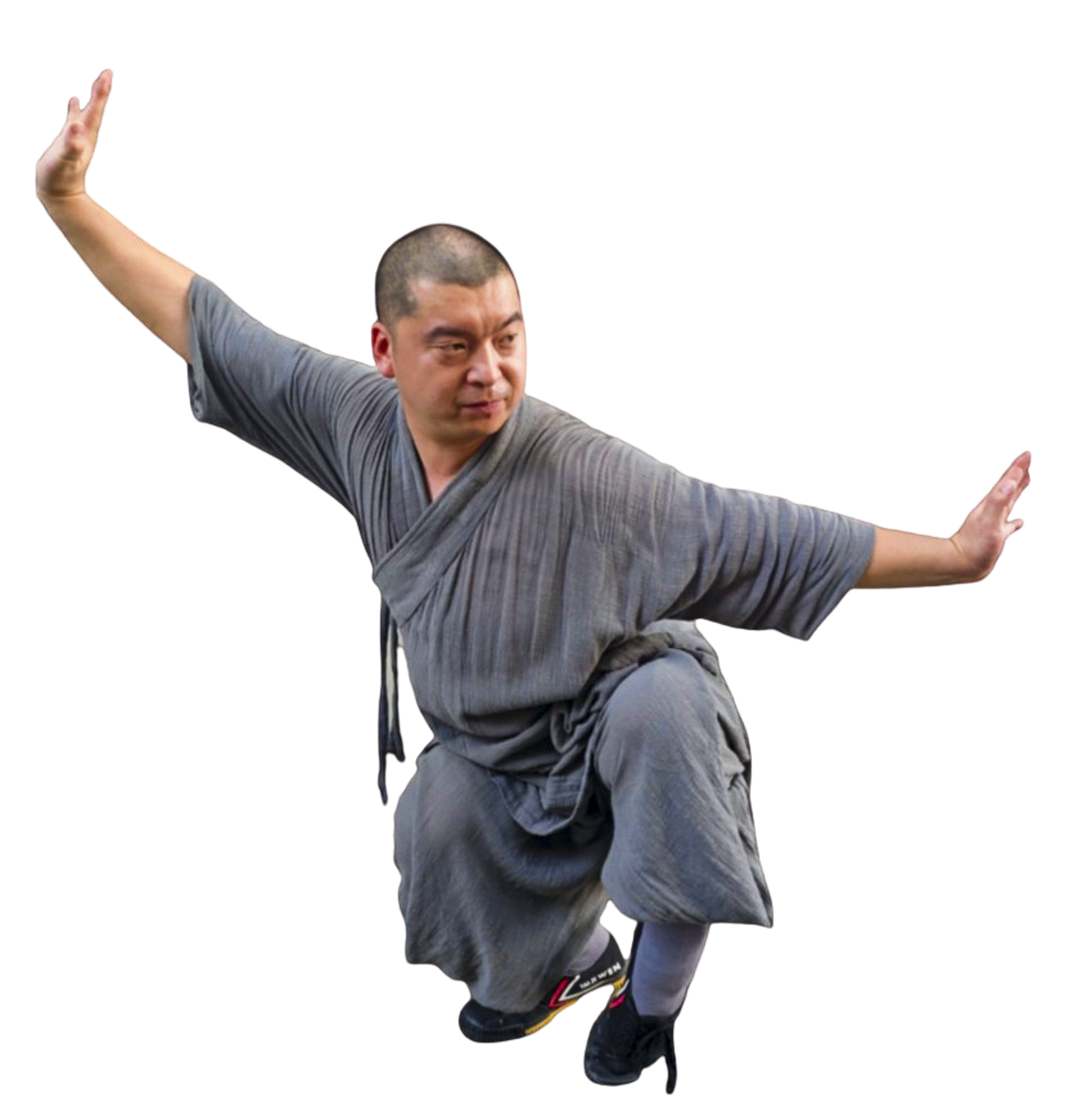 Man in gray traditional martial arts attire performing a balanced kung fu pose with arms extended.