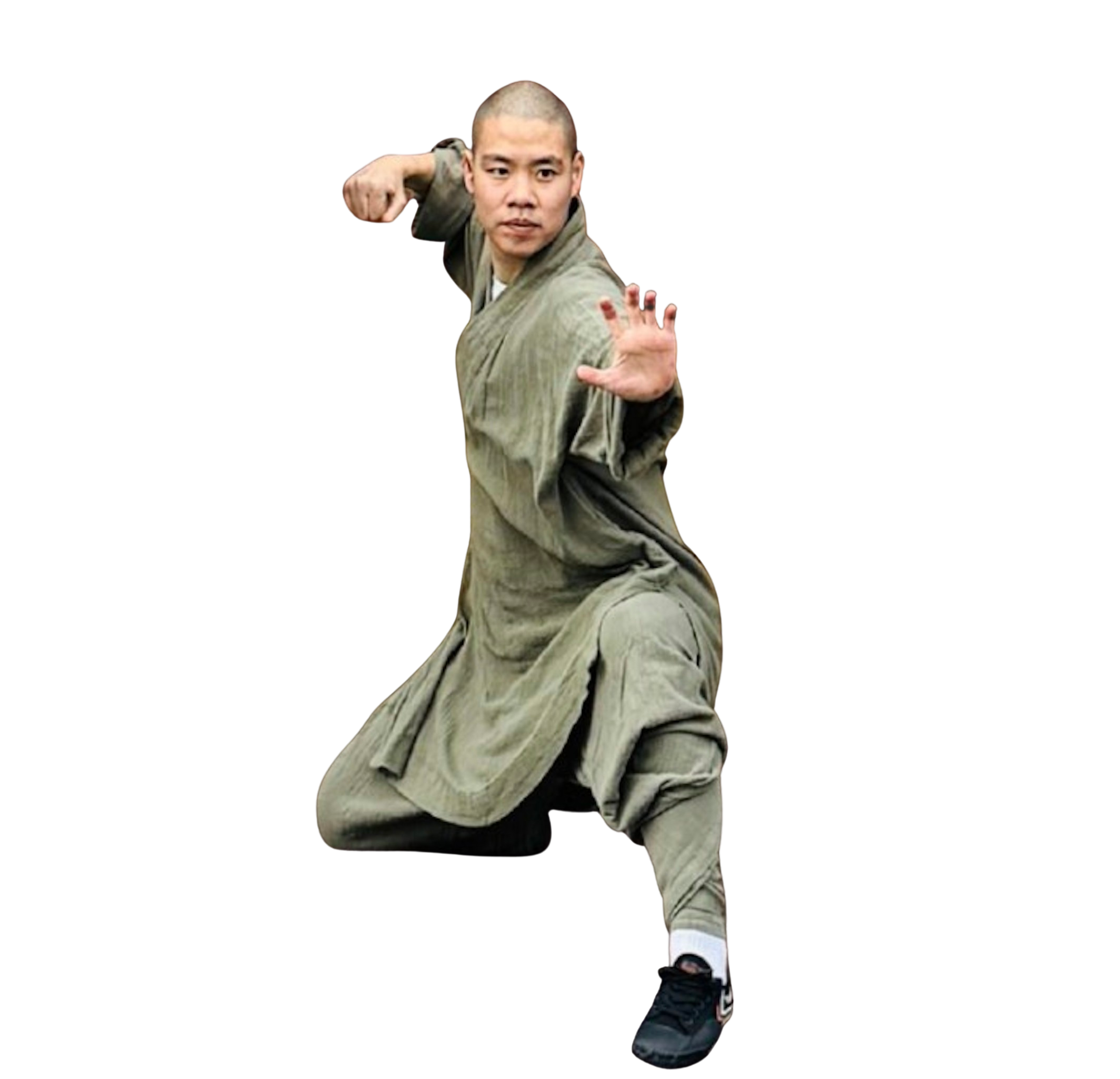 Man in traditional martial arts clothing in a low fighting stance performing a kung fu pose.martial art london Shaolin Xiu
