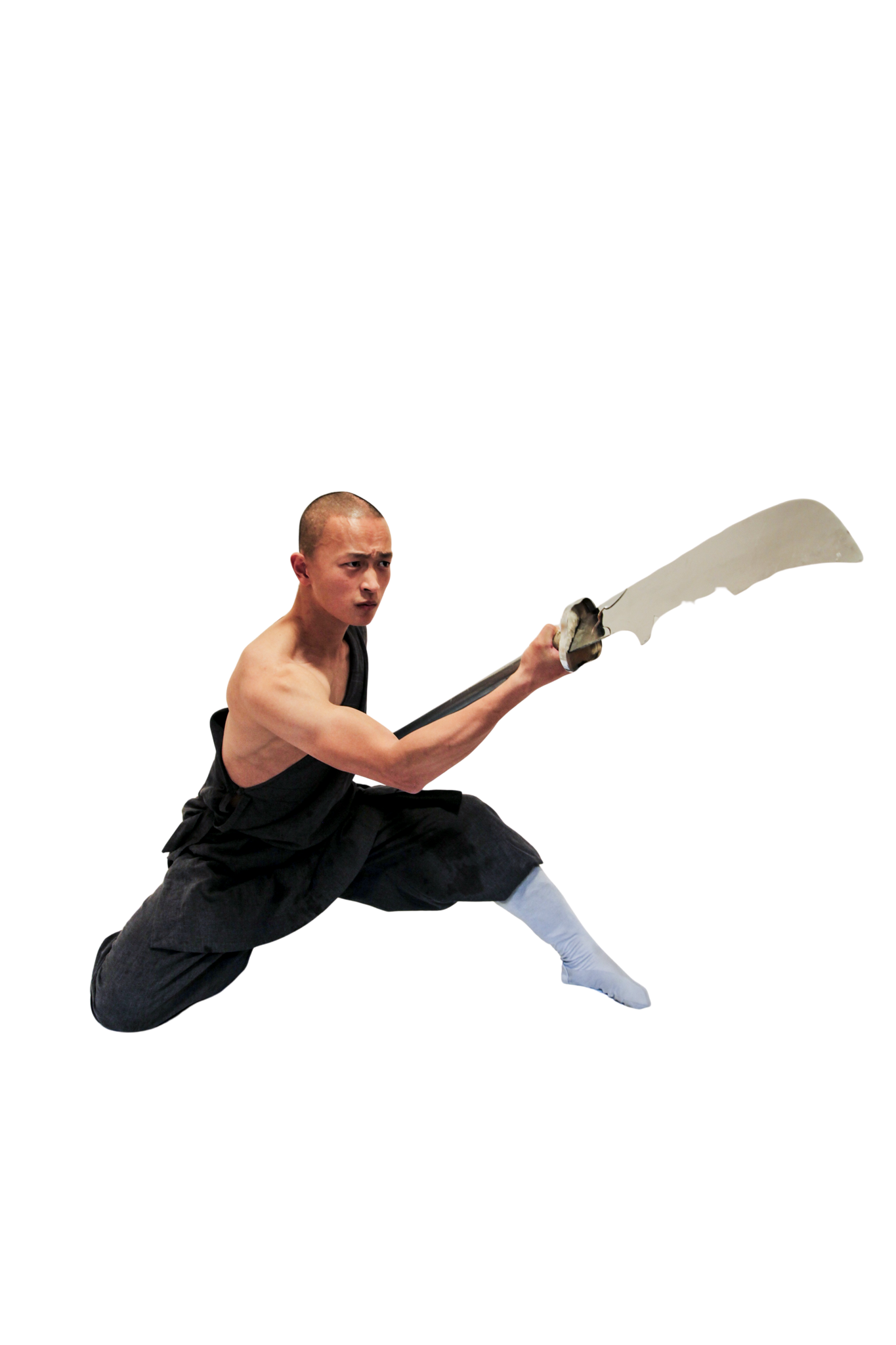 Martial artist in mid-air jump holding a large curved sword with focused expression.martial art london Shaolin Xiu
