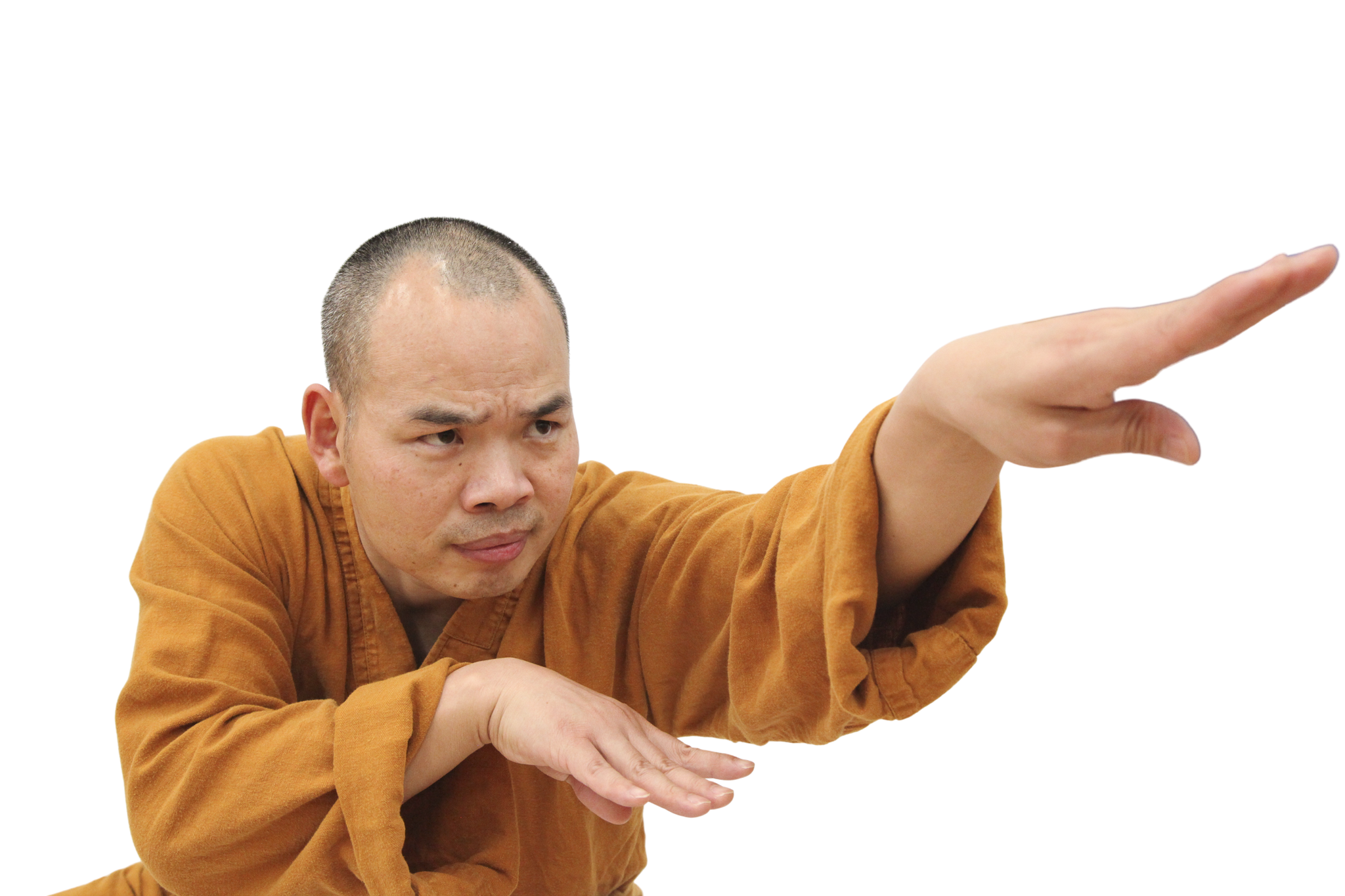Man in an orange robe striking a focused martial arts pose with one arm extended forward and the other bent at the elbow.martial art london Shaolin Xiu