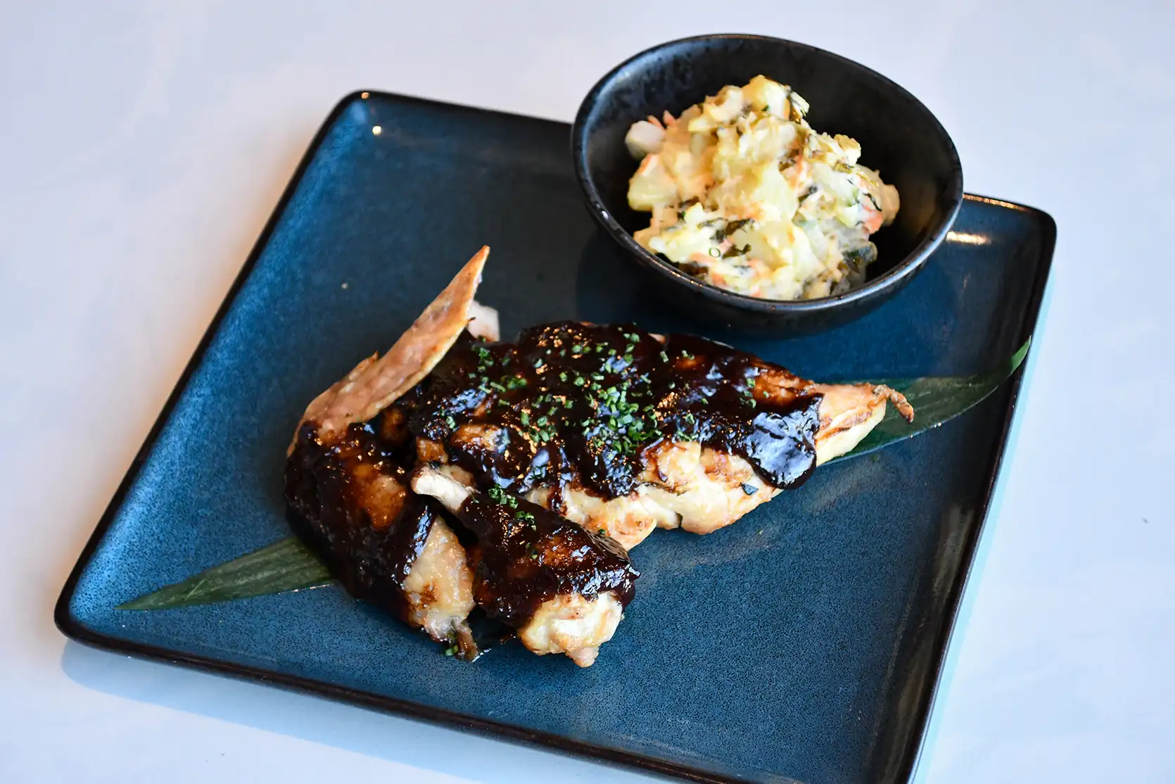 Robata-grilled chicken dish with side