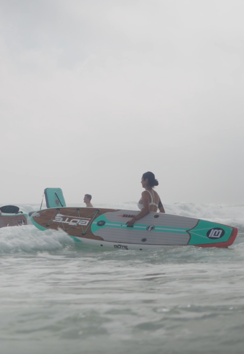 Guy holding a paddleboard