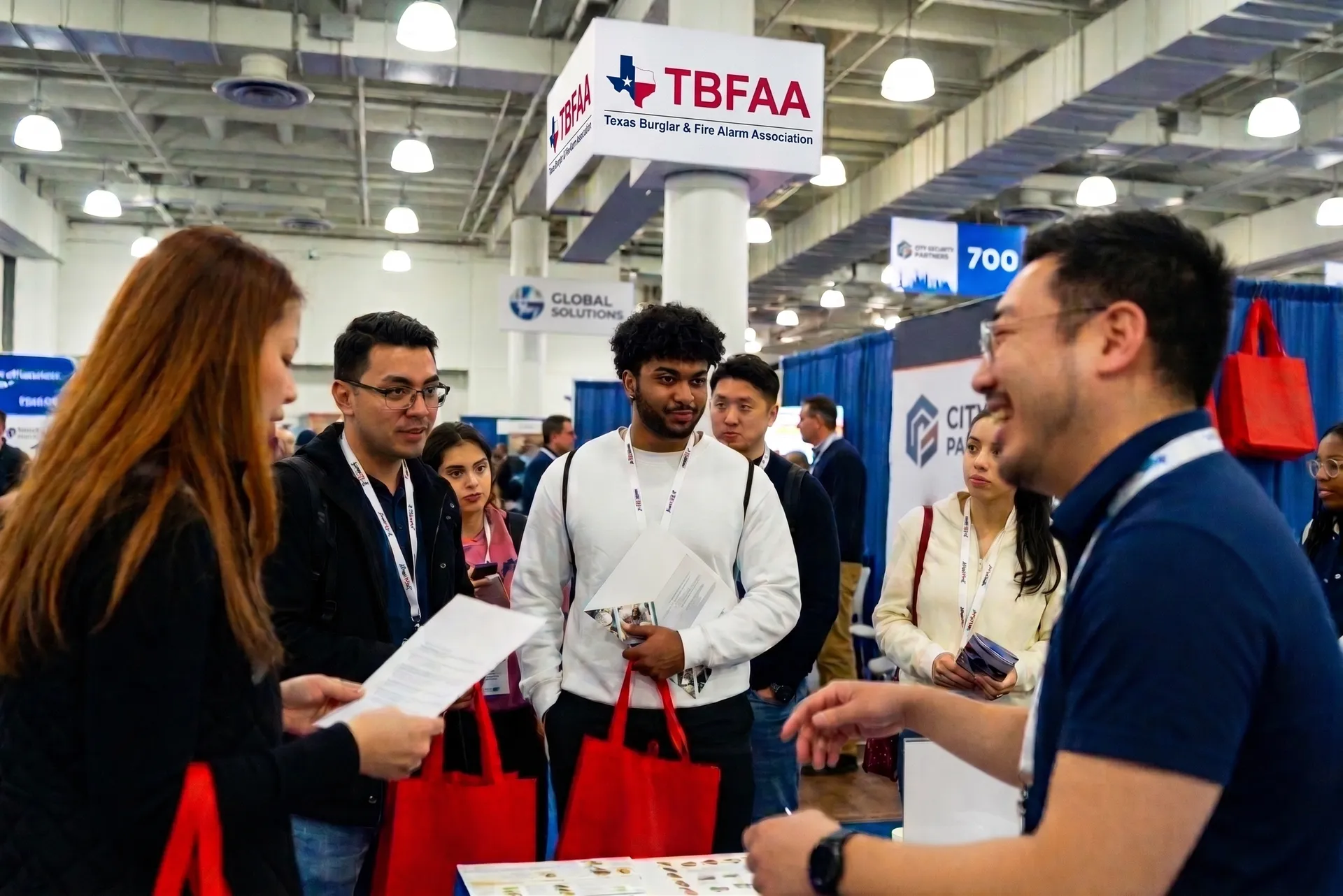 AURA team connecting with attendees at the TBFAA Convention and Trade Show exhibitor floor