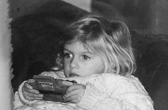 Emilie young holding a gameboy