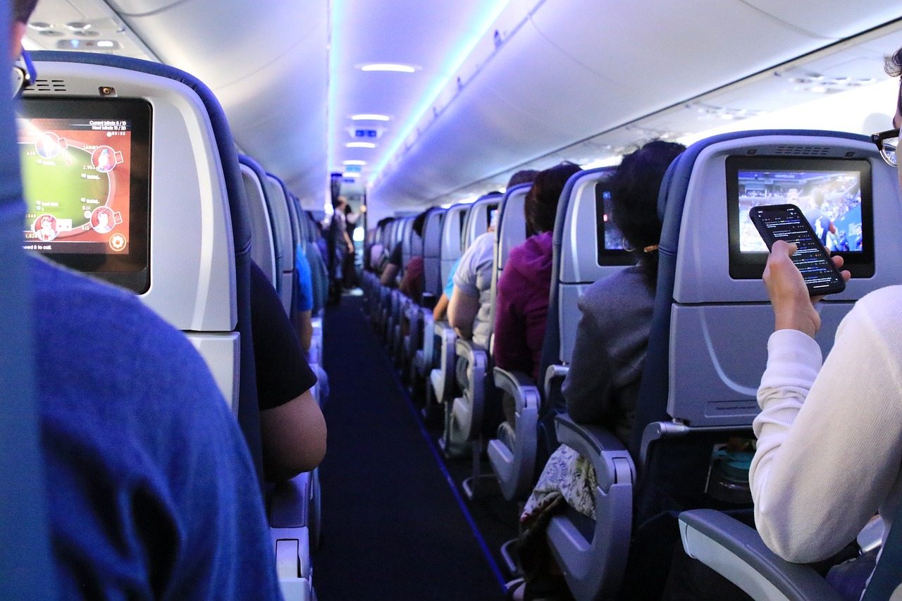 Passengers in an economy cabin on a plane