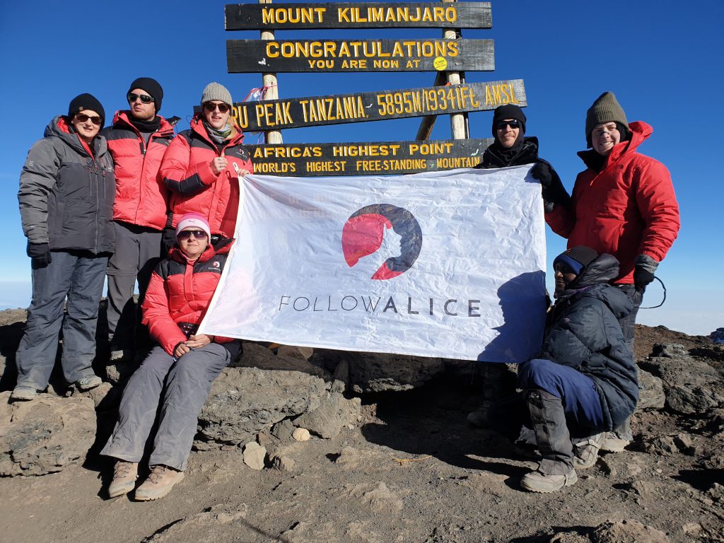 Group-photo-at-Kilimanjaro-summit-with-Follow-Alice-flag-1024x768.jpg