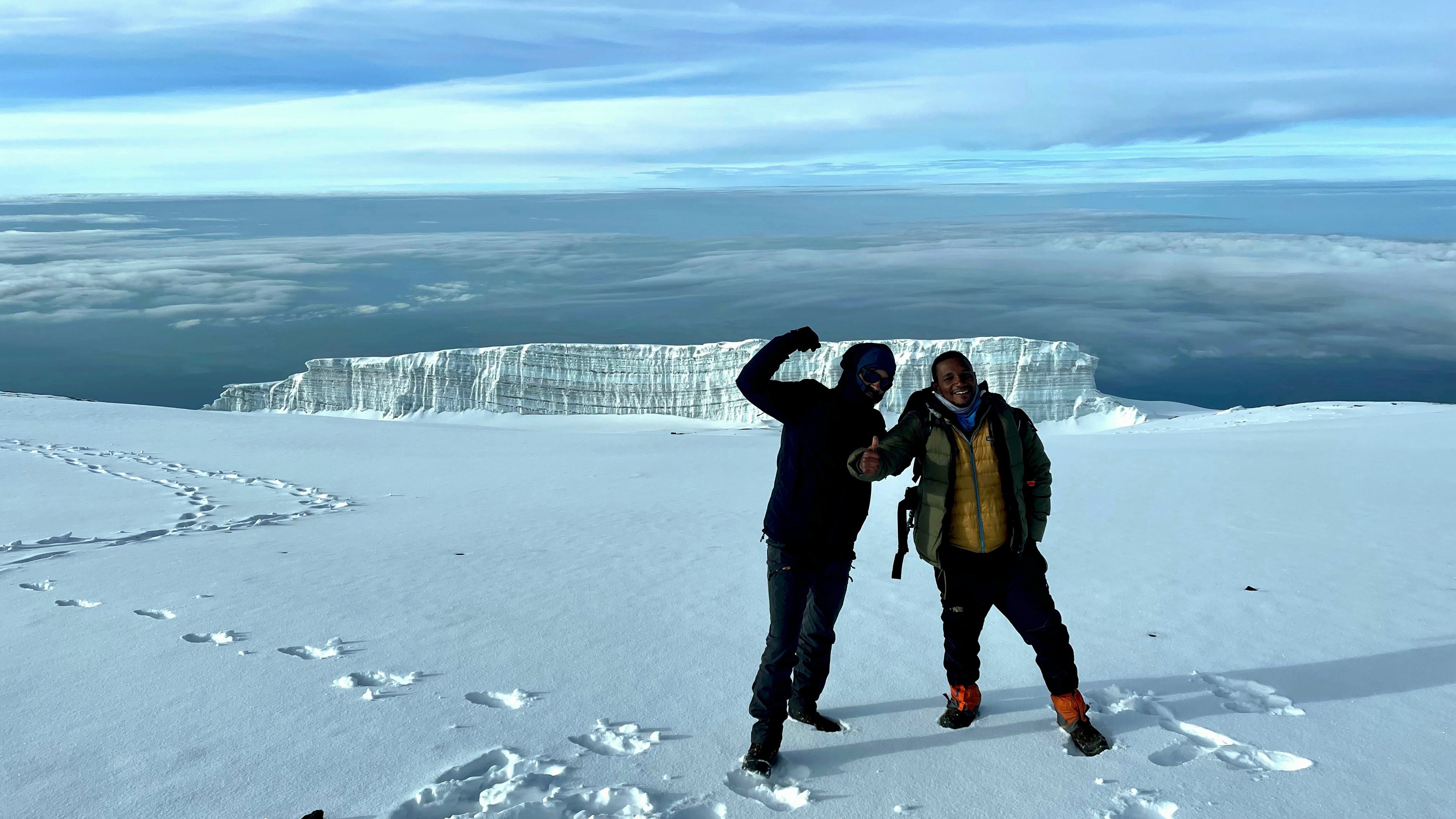 Kilimanjaro summit day snow glacier clouds climbers George K
