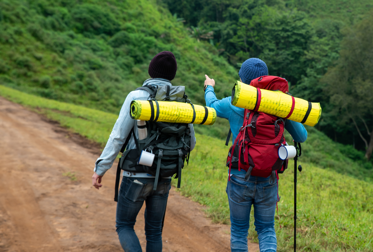 Ours. S. Two hikers with backpacks