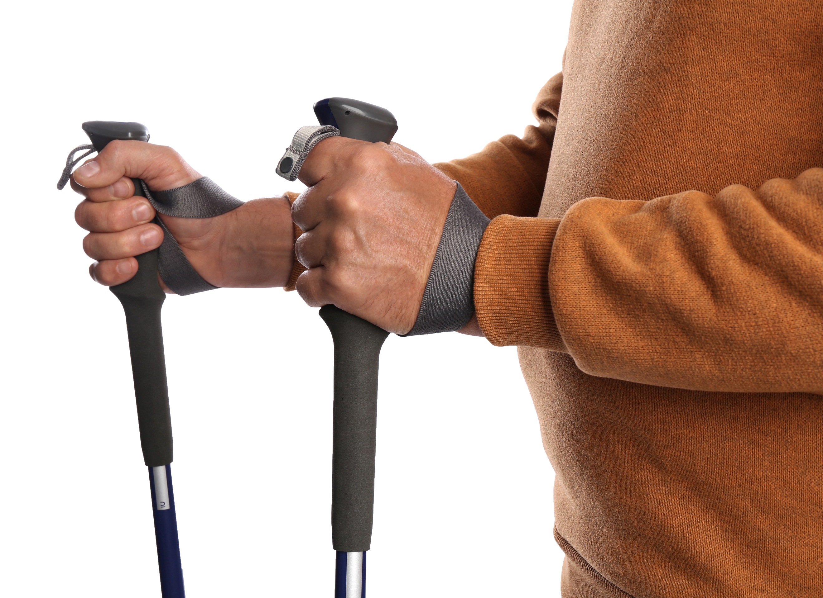 Ours. S. Man holding trekking poles in correct manner