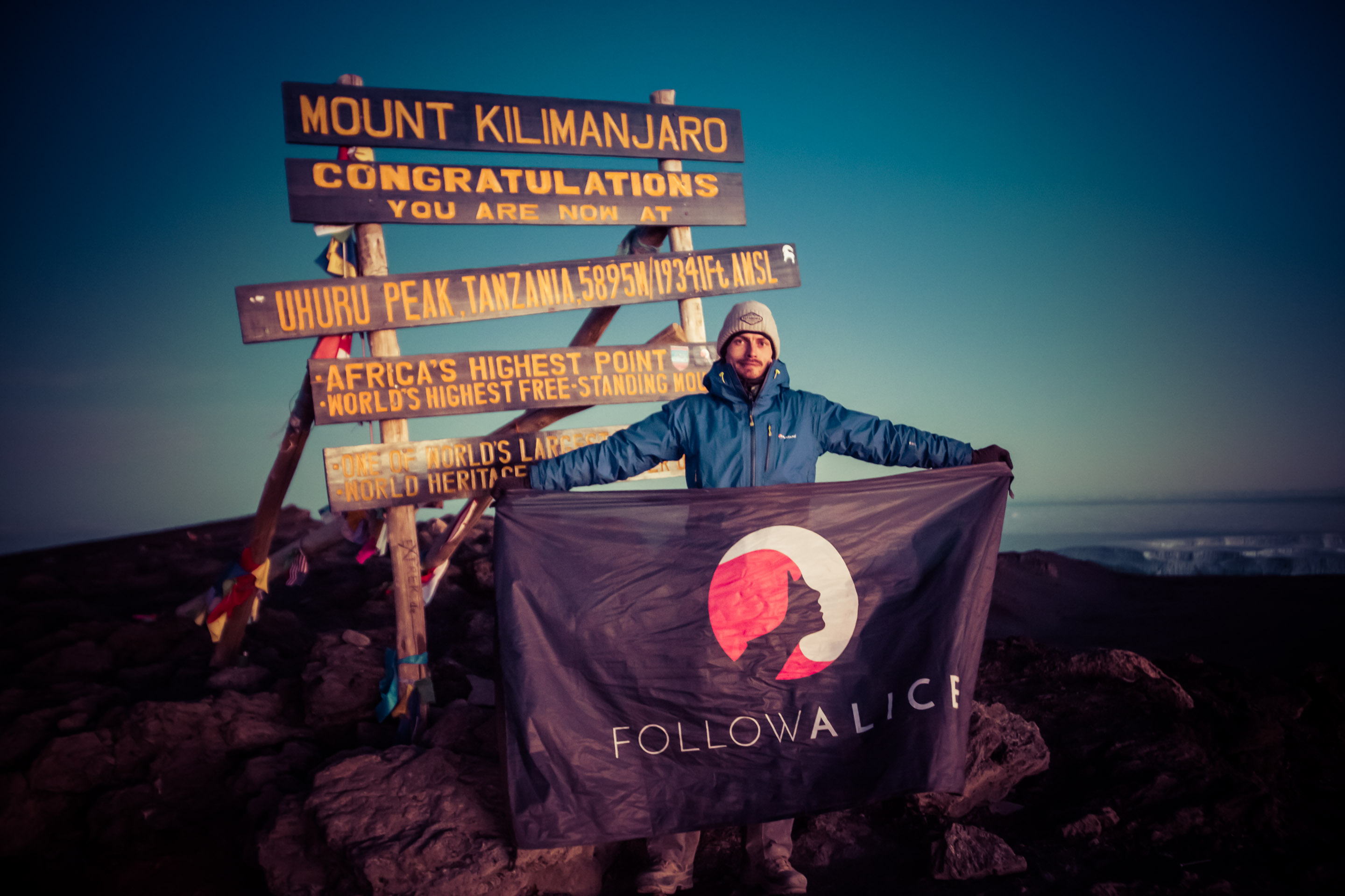 holding-follow-alice-flag-t-kilimanjaro-summit.jpg