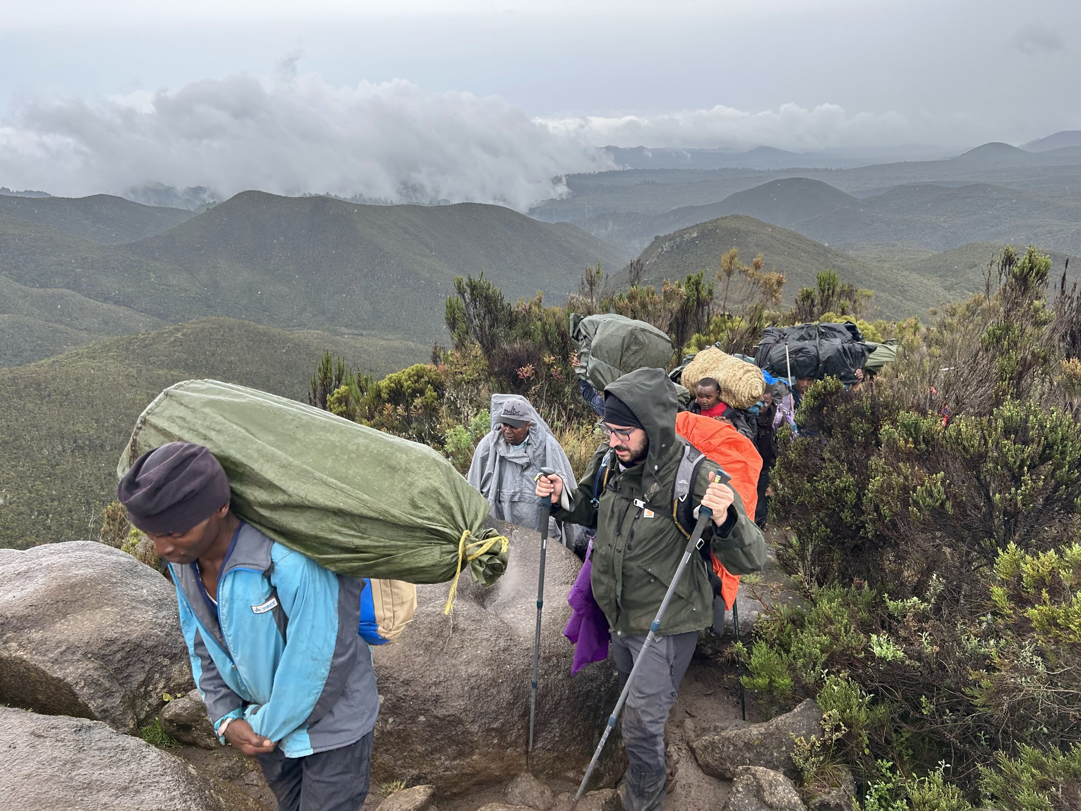 Romy. Porters on trail on Kilimanjaro